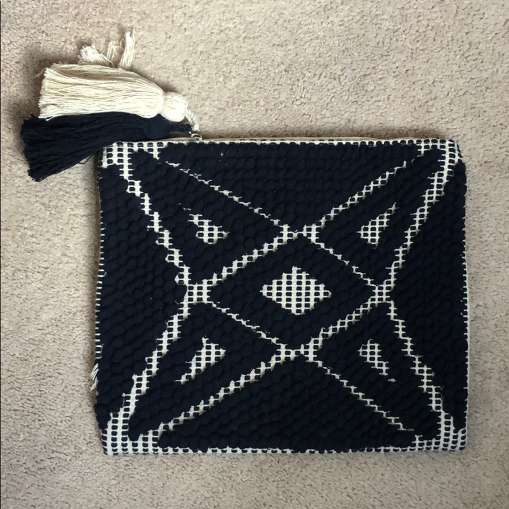 Navy and beige clutch with tassels